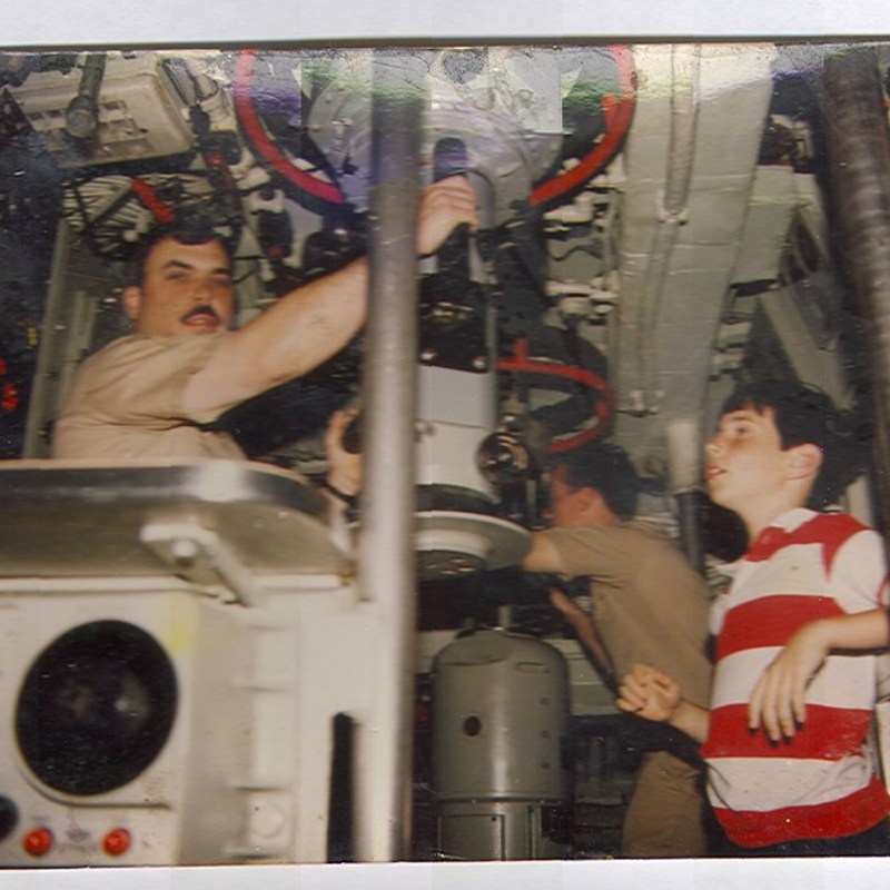 Even on a Nuc sub Bill takes time to work with his oldest son. This was taken at sea on a family & dependents cruise on USS Ben Franklin. Bill was the Captain of the ship.