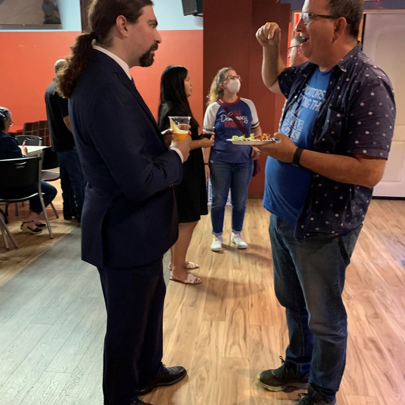Chatting with guests.