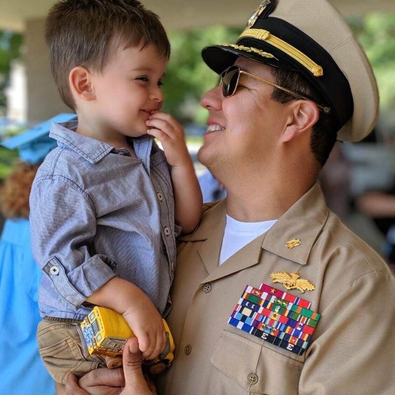 Retired Navy Captain, and former Marine, Mike Monreal, enjoying a special moment with his grandson.