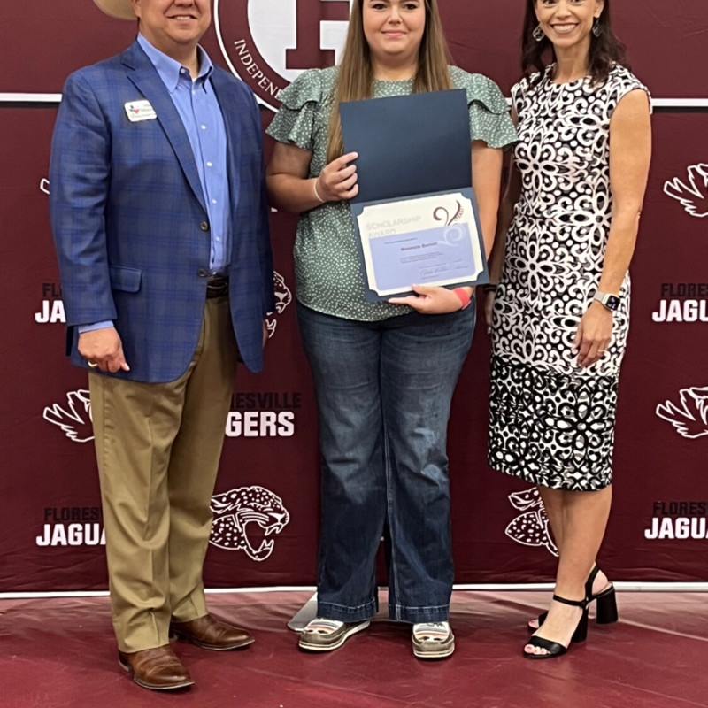 Mike and fellow WCRW members present local Floresville High School student with the WCRW Scholarship.