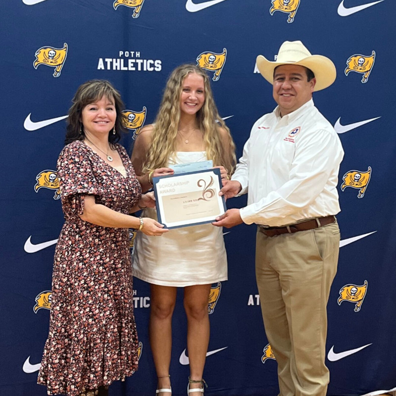 Mike and his wife presenting a Wilson County Republican Women's Club Scholarship to a local Poth student.