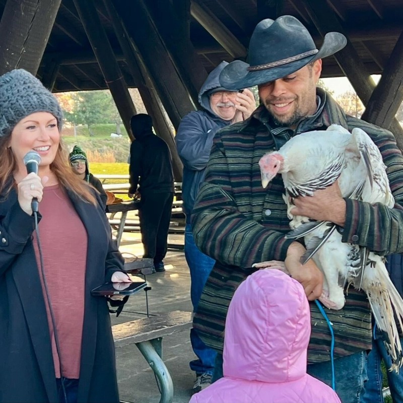 Pardoning a turkey on Thanksgiving, 2023 at Sarg Hubbard Park at the Greenway's Turkey Trot.