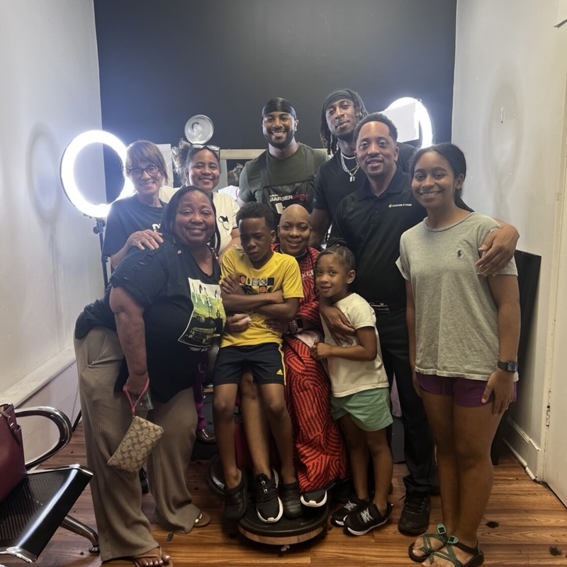 Me with my family as my baby sister Mary Ashely was getting her hair cut due to breast cancer. Family first.