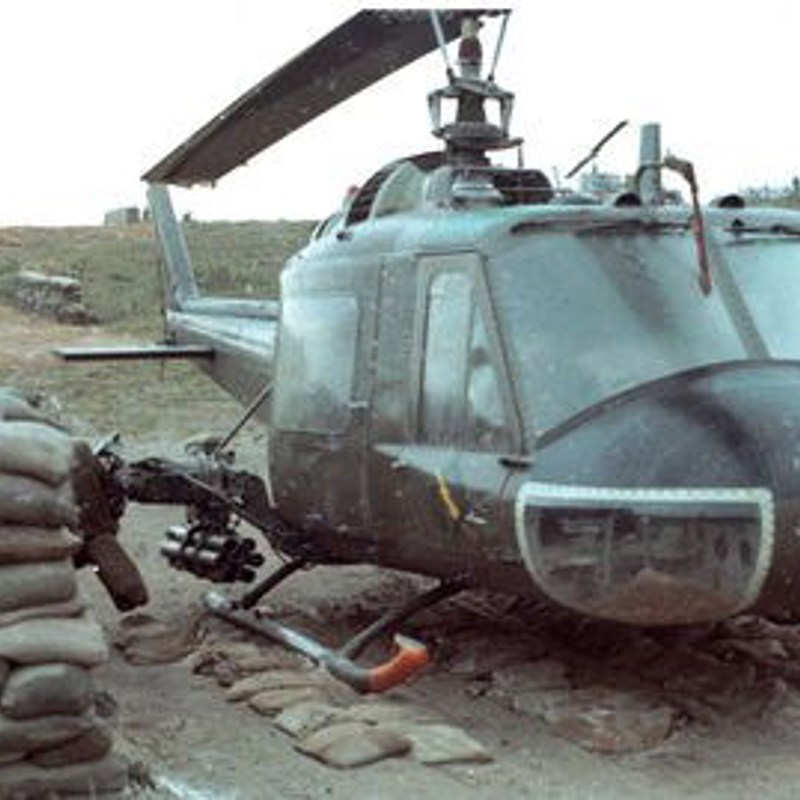 A UH-1C Charlie Model gunship in a protective revetment.
