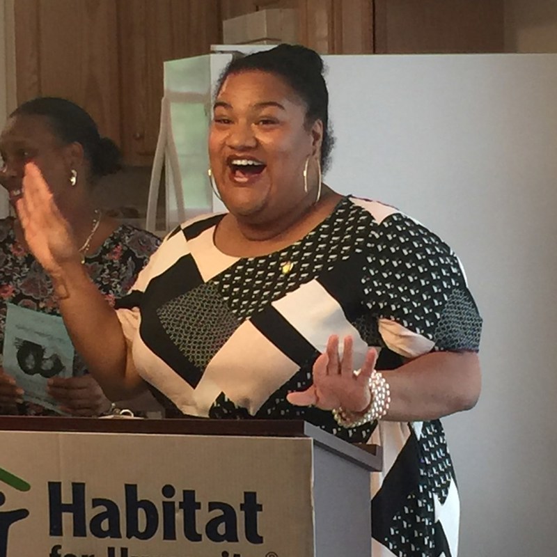 Giving remarks at a Habitat for Humanity ribbon cutting on a new home in the 95th District