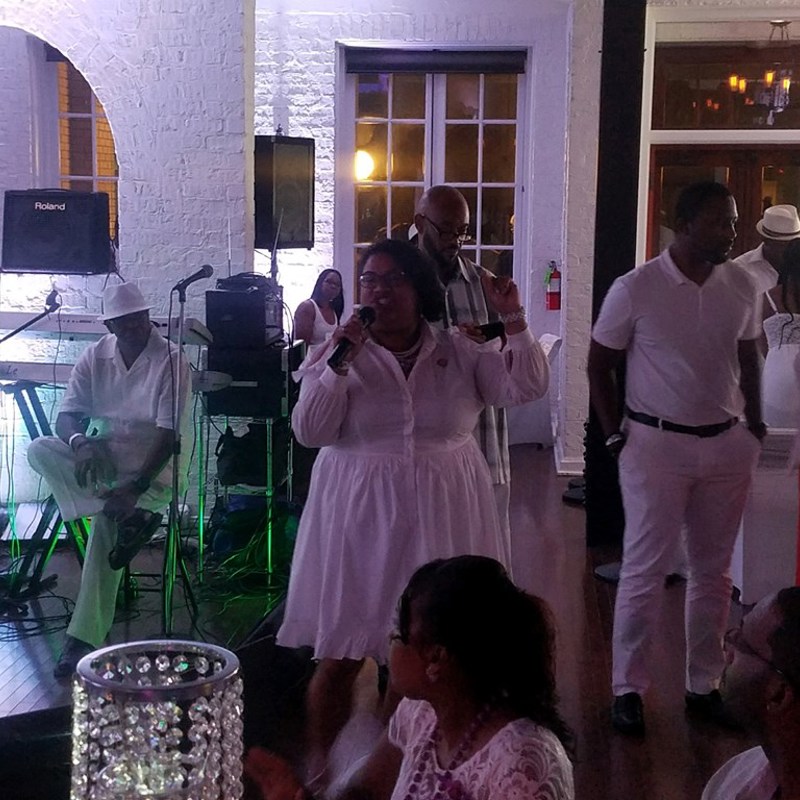 Giving welcoming remarks at The Group's All White Party to benefit the fight to end lupus