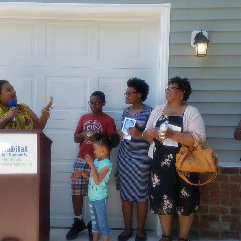 Giving welcoming remarks at a Habitat for Humanity ribbon cutting in the 95th District