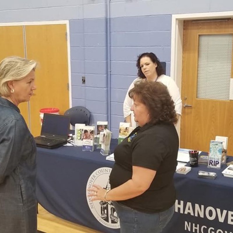 Representative Butler visits the Hurricane Preparedness Expo at the MLK Center. Seen here with a member New Hanover County's emergency operations team.