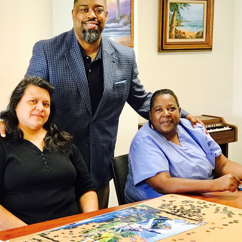 Dr. Fizer with some of the employees of Cornerstone Gardens.