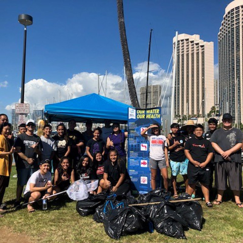 Waterkeepers help us clean the waters of the Ala Wai Small Boat Harbor, experimenting with oysters at the Hawaii and Waikiki Yacht Clubs. Helping with the cleanup are Damien School student volunteers.